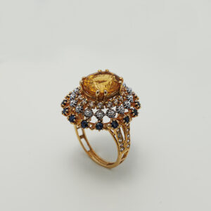 A Ring with Golden Topaz, Sapphires and zircons