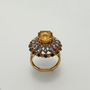A Ring with Golden Topaz, Sapphires and zircons