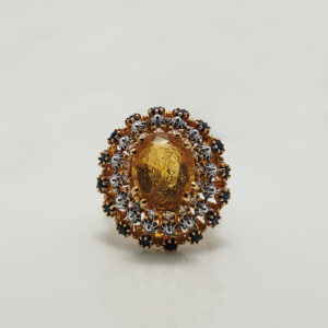 A Ring with Golden Topaz, Sapphires and zircons