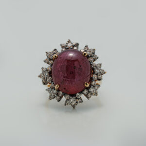 A Ring with Cabochon Ruby and zircons
