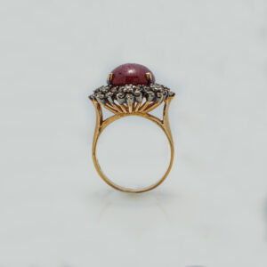A Ring with Cabochon Ruby and zircons
