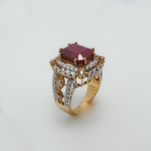 A ring with Ruby and zircons