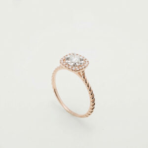 A radiant diamond halo set in luxurious 18K gold