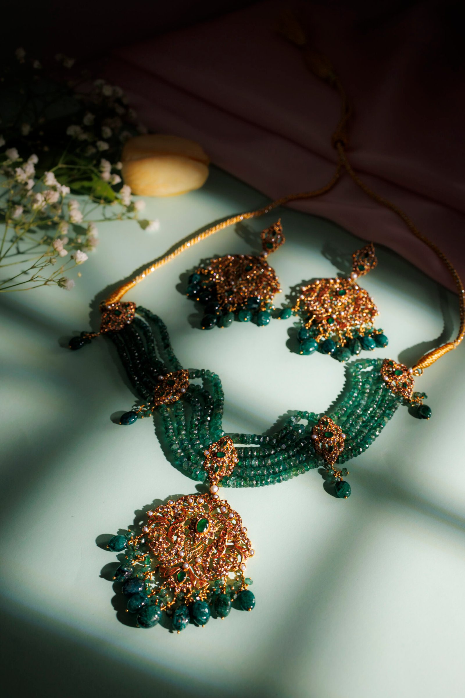 Sunar Collection gold necklace with green gemstone strands